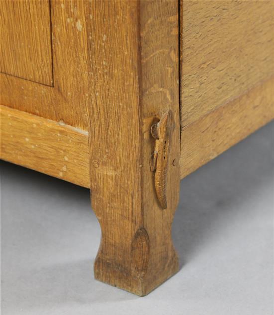 Derek Lizardman Slater. An early 20th century oak desk, W.6ft D.3ft H.2ft 4in., together with a matching desk chair